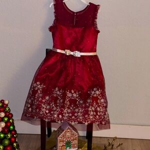 A red Girl’s dress with silver sparkles